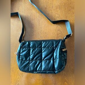 Quilted zippered handbag in Black
